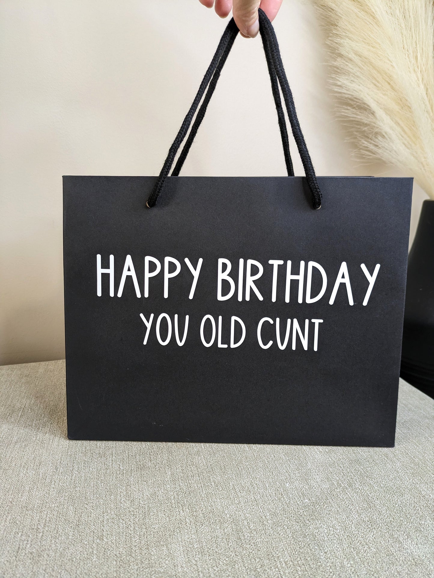 Black funny gift bag. Novelty design with black handles