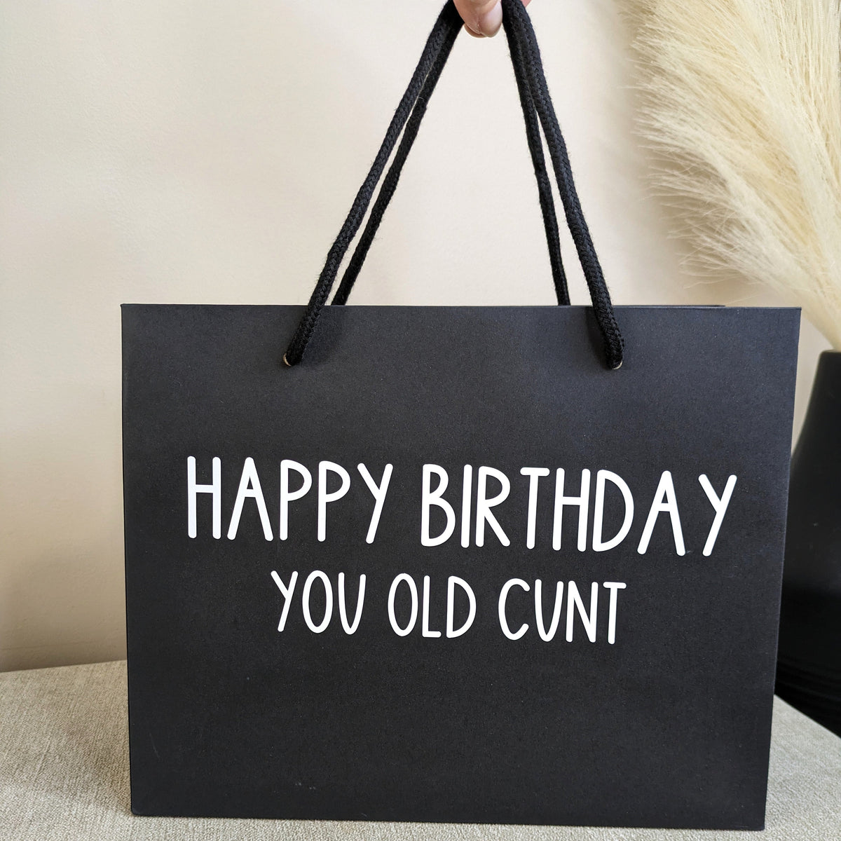 Black funny gift bag. Novelty design with black handles
