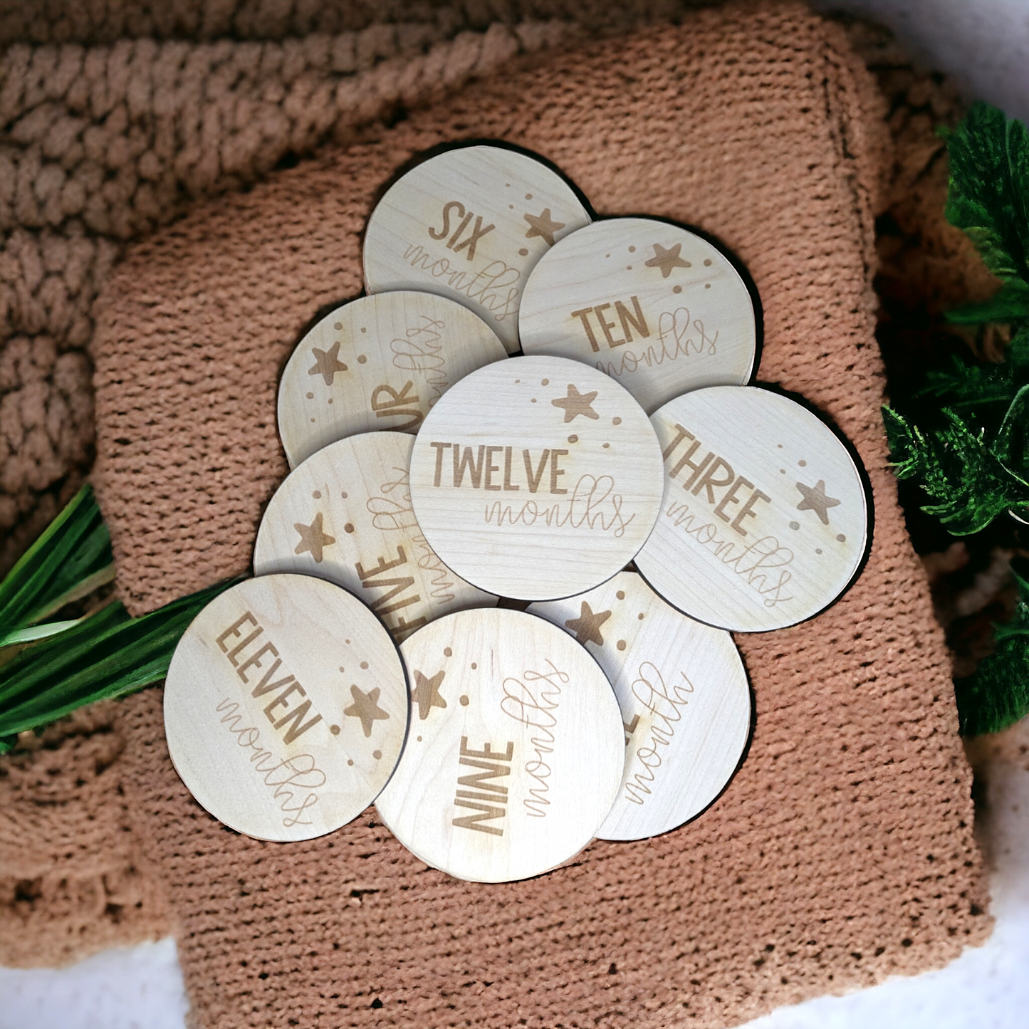 set of 12 light wood baby milestone dics. With a cute star design engraved.