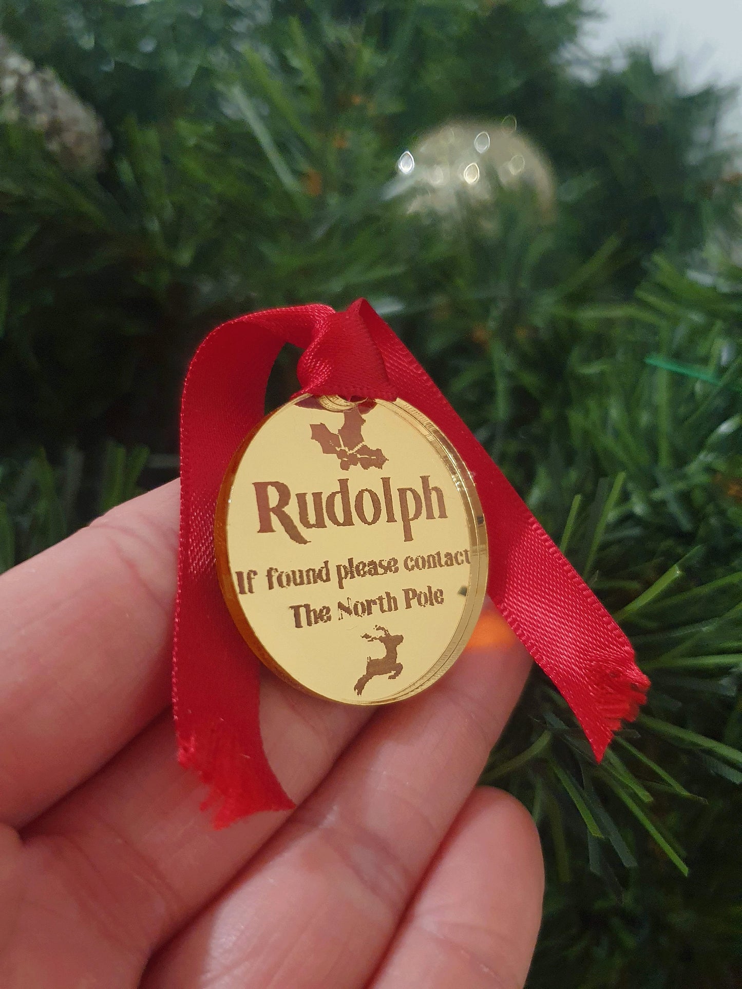 gold missing ID tag for rudolph that has fallen from the sleigh