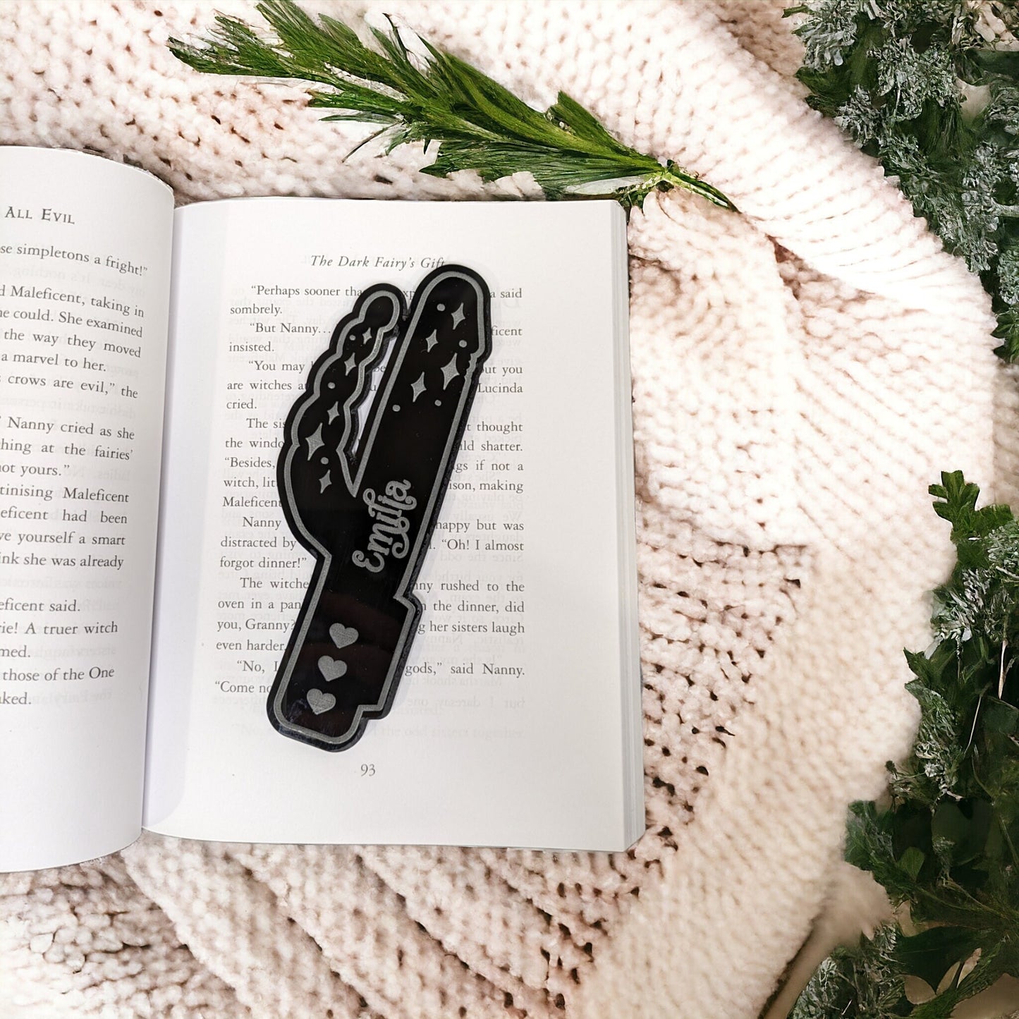 An erotic bookmark. Made in the shape of a sex toy with a personalised name in the middle.
