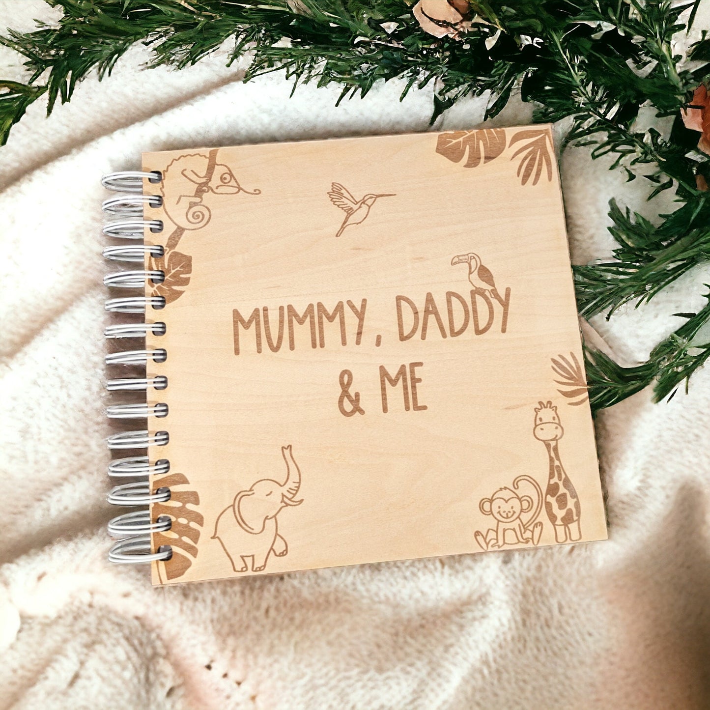 neutral baby room with engraved animals in the wooden photo album.