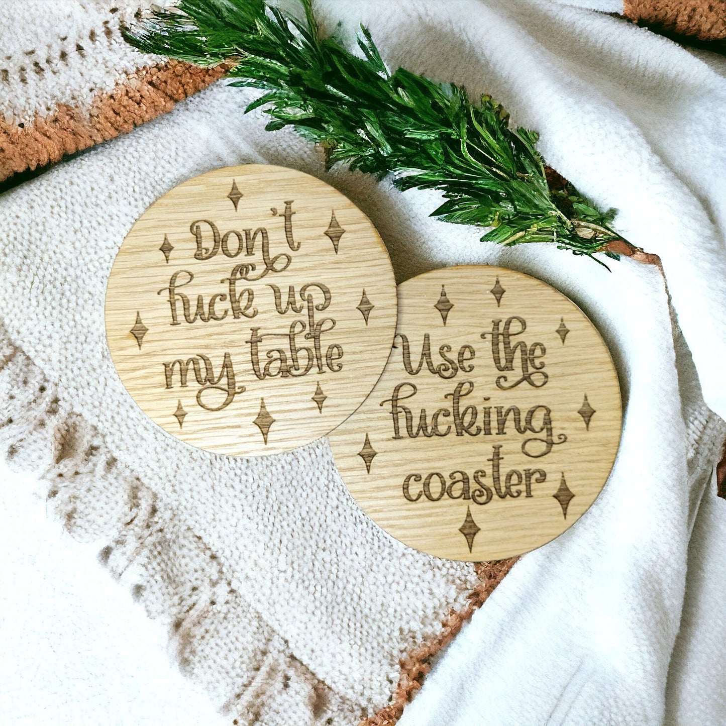 round girly coaster set for a coffee table. Contains swearing and profanity.