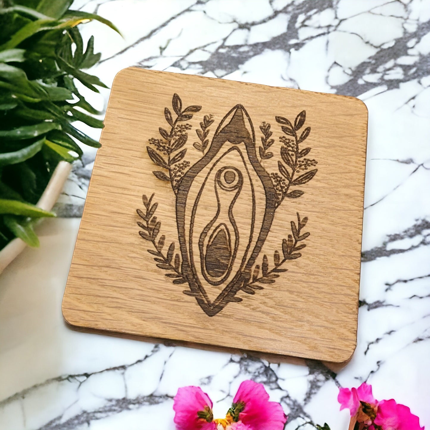 a beautiful nude women vagina engraved on to a coaster. Women decor