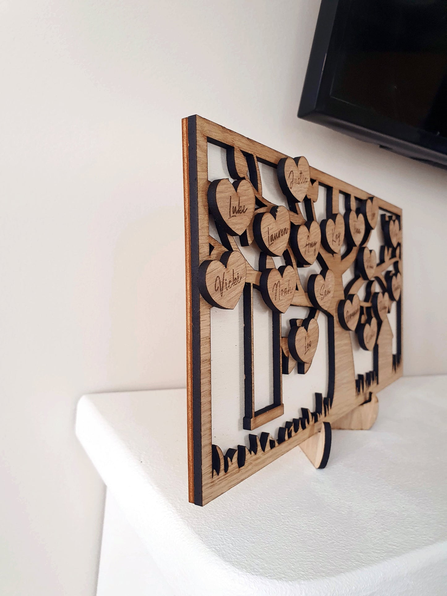 Grandparent family tree with a rope swing and branches. Beautiful oak design with hearts engraved with every family member