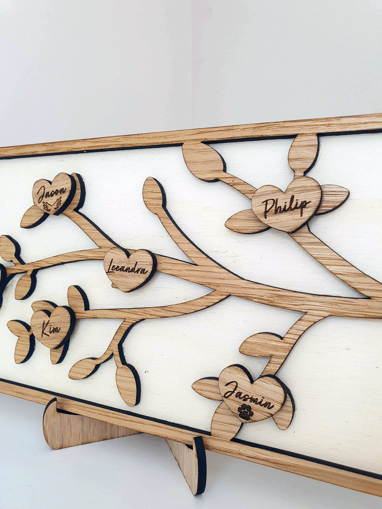 family tree that includes dogs and pets. Each heart on the family tree has a family member including pet.