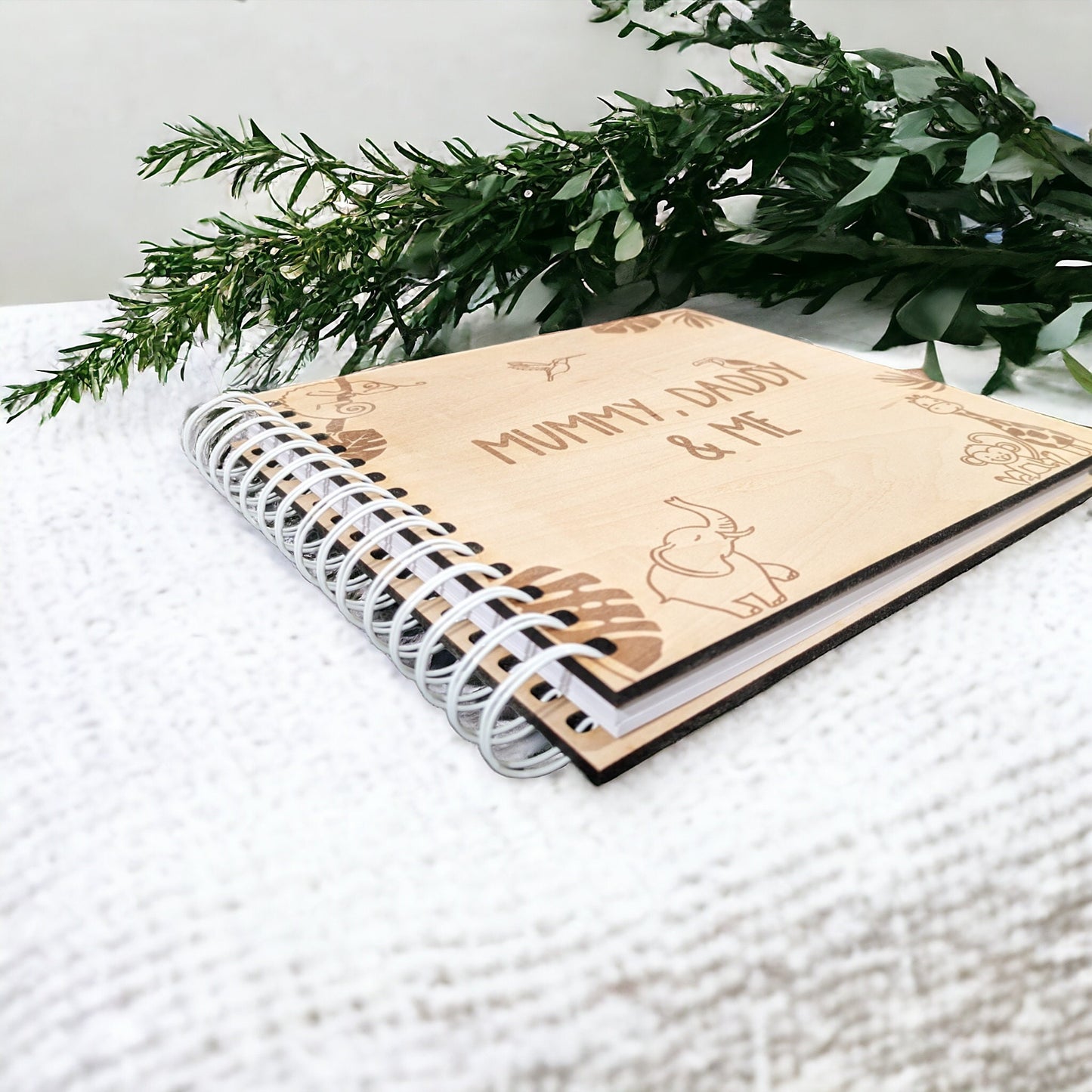 New baby scrapbook with cute animals engraved. The memory photo album is a great personalised gift for new parents.