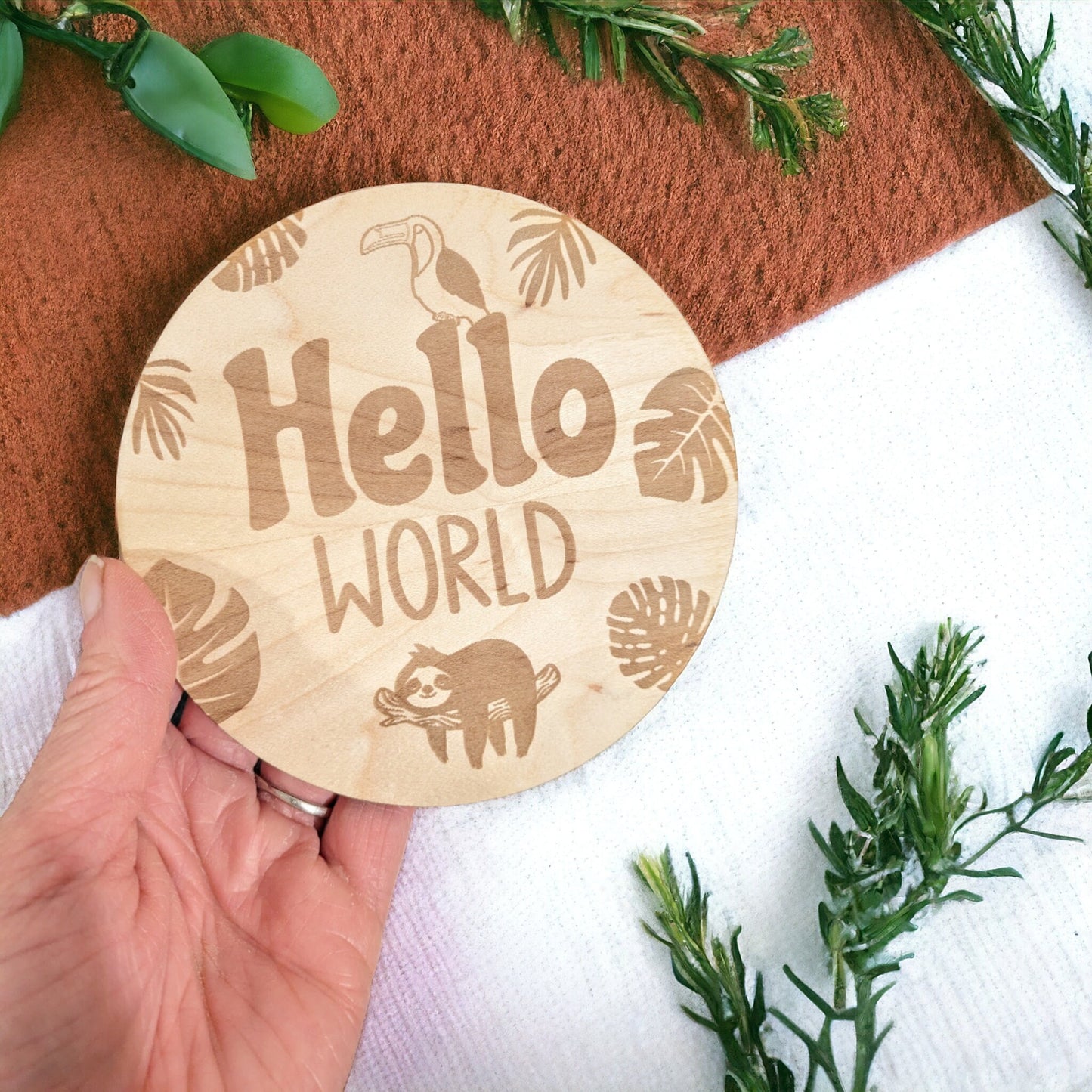 Beautiful maple wood with the words ' Hello World ' engraved in to the plaque. Designed for new born baby photo shoot. Jungle Themed