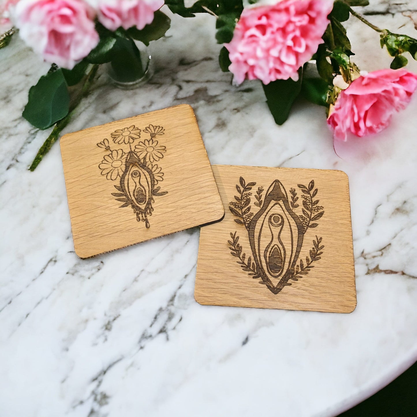 set of two beautiful vagina coasters. Made with oak wood and a lovely floral design. Perfect for a coffee table to celebrate your yoni