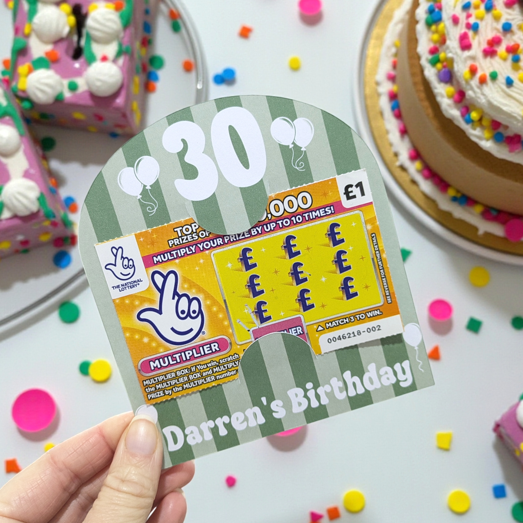 A personalised 30th birthday party favour that says darren's birthday with a birthday table in the background
