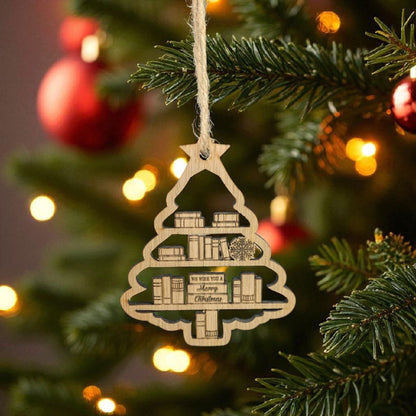 Decorative Christmas tree ornament with book design hanging on a Christmas tree.