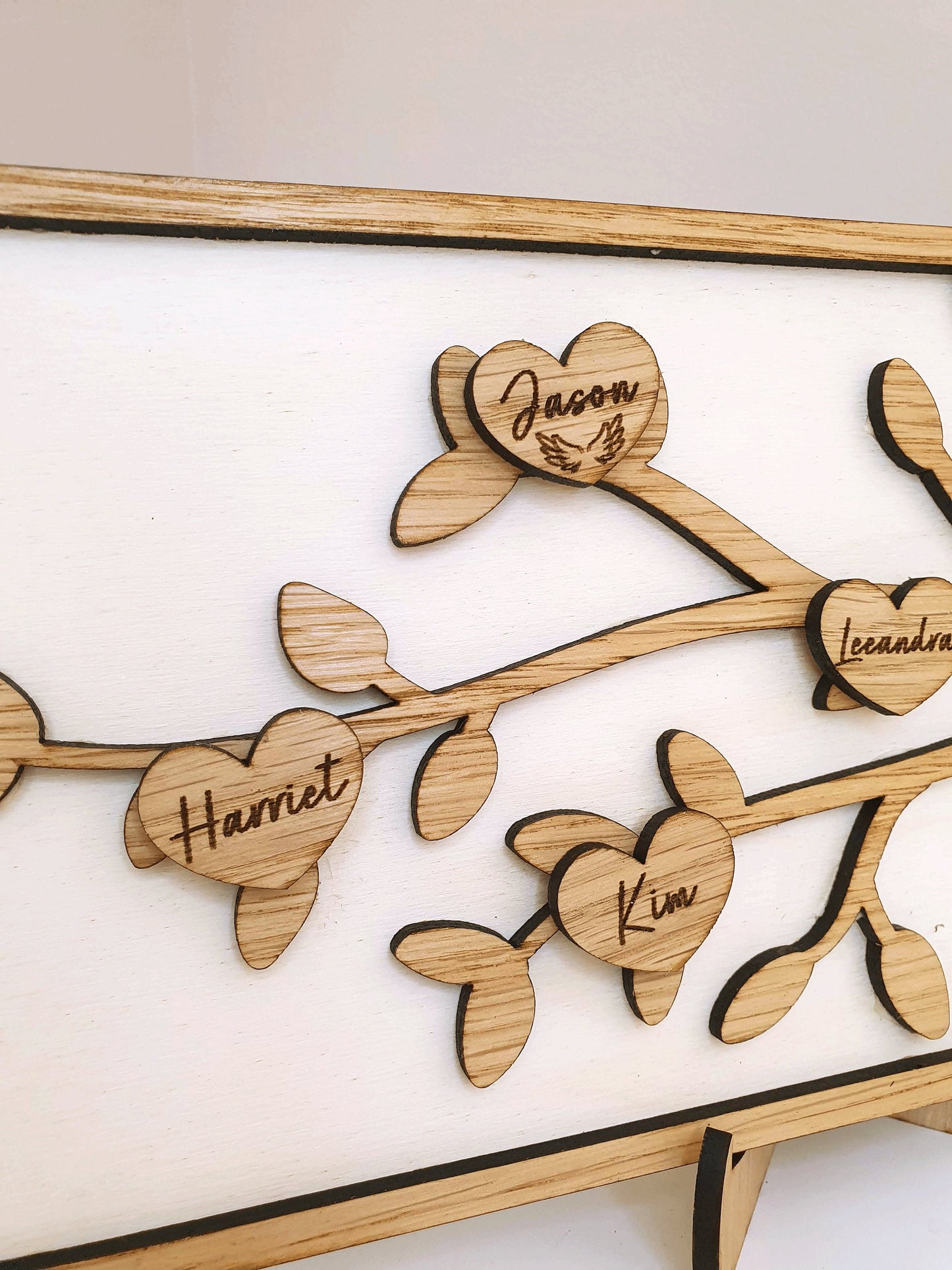 Family branch made with oak wood. With a memorial heart.