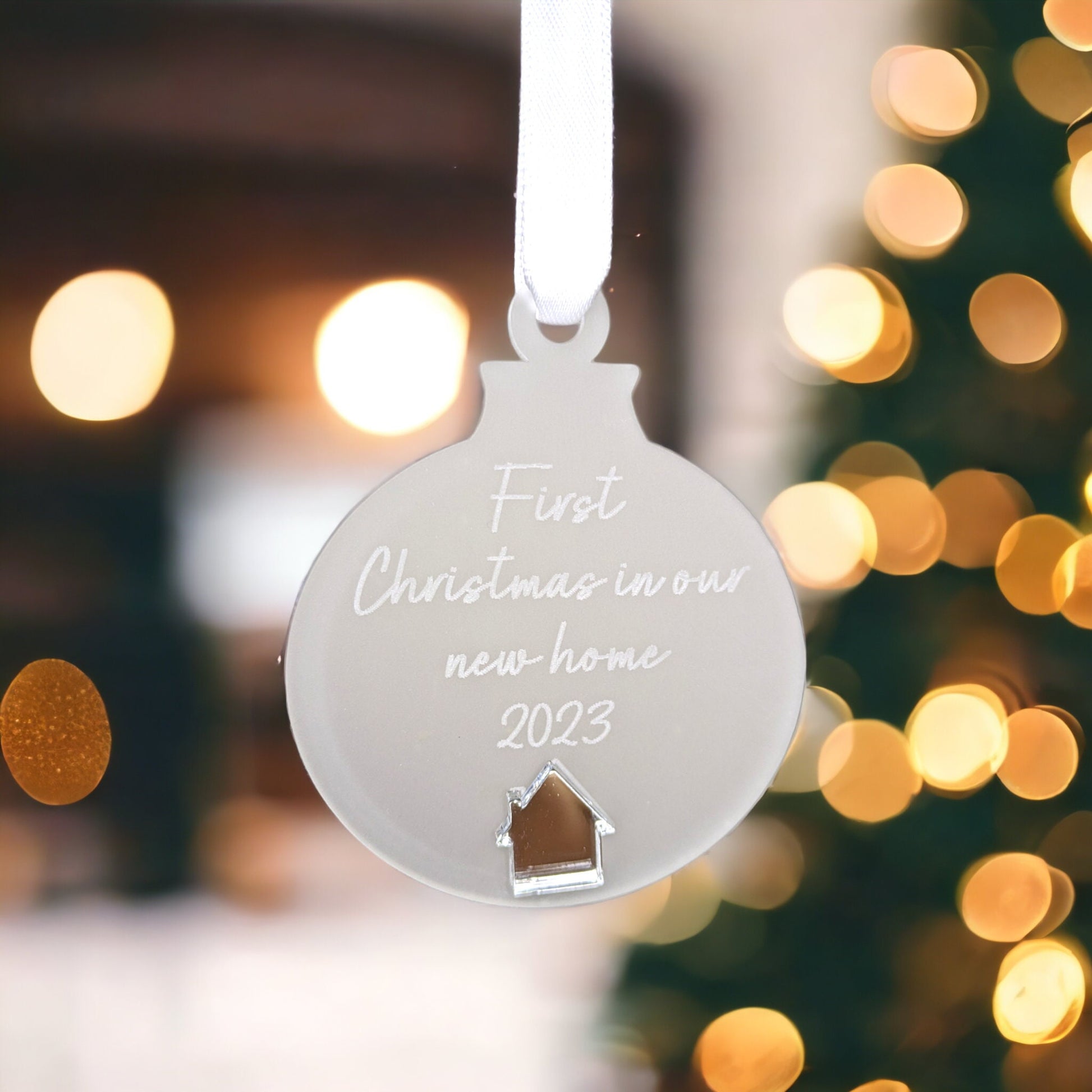 Engraved first home christmas ornament.