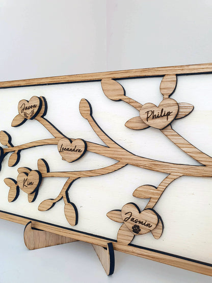 Personalised wooden family tree plaque. Free standing with grandchilderns names engraved in to the oak hearts.