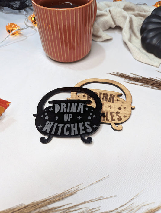 set of 2 coasters that are witched themed. Made out of black acrylic and oak wood. 