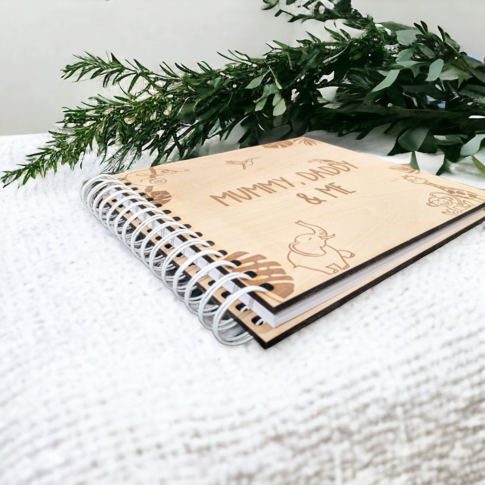 New baby scrapbook with cute animals engraved. The memory photo album is a great personalised gift for new parents.