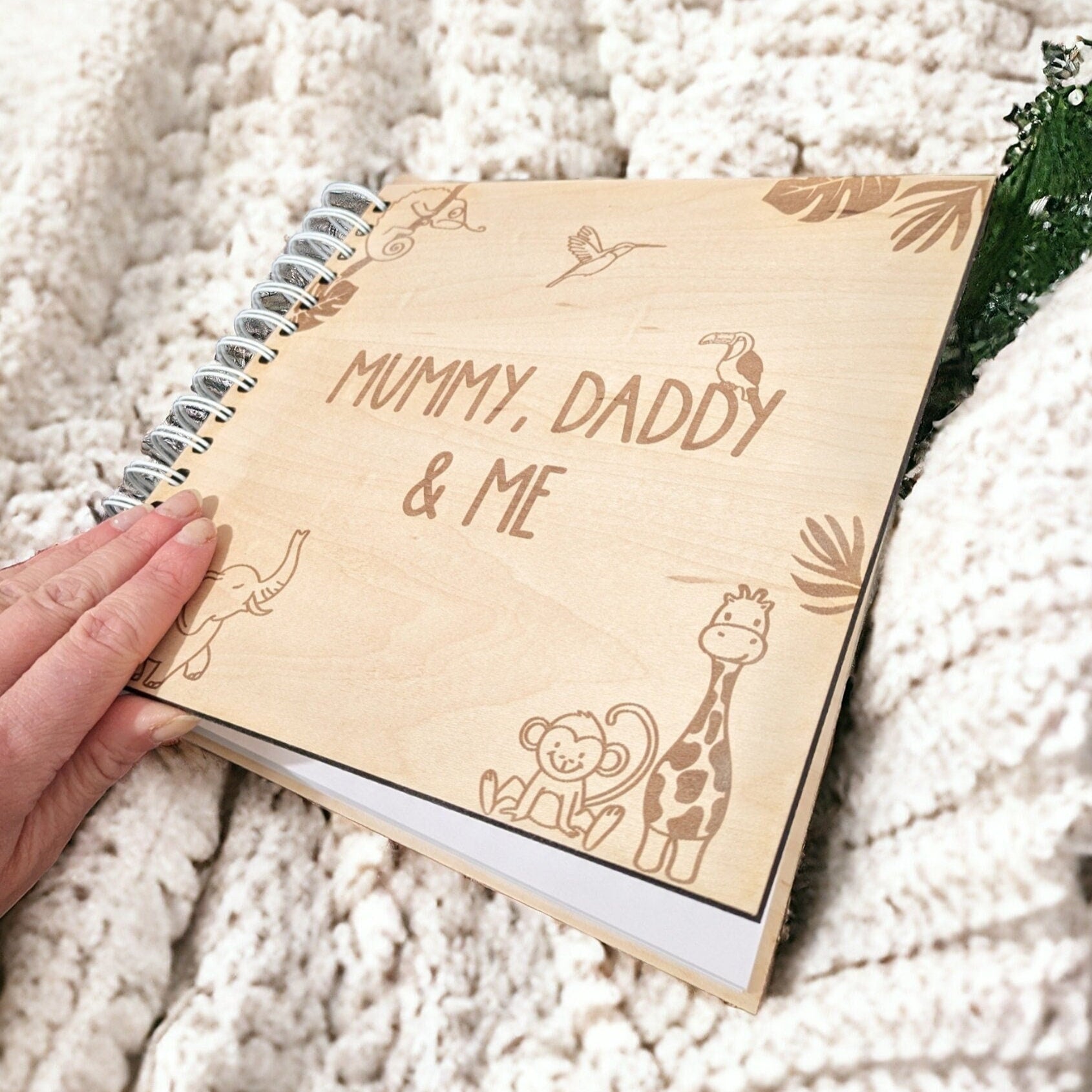Wooden baby photo album with a animal jungle theme. Memory book for mummy, daddy and baby.